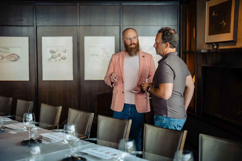 Dane Groeneveld and Jonathan Raymond talking before dinner