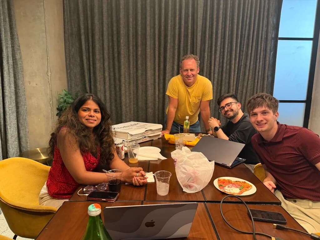 The Ren team around a table on a work night